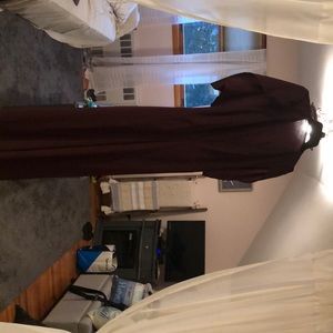 Gorgeous jumpsuit. Halter top with a half cape attached. Deep wine color.